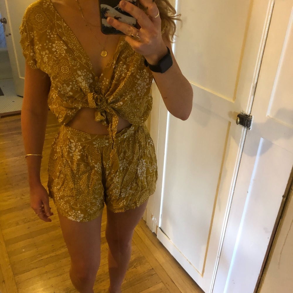 Mustard floral romper. Never worn!
